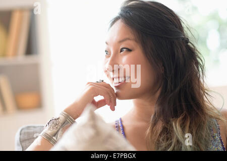 Portrait of young woman smiling Stock Photo