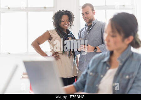 Man and women working in office Stock Photo