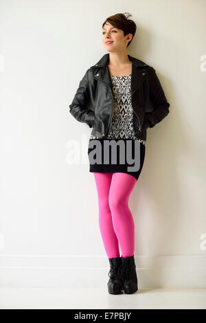 Young woman wearing pink stockings Stock Photo