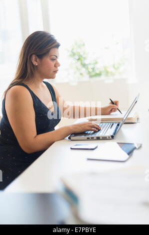 Woman working in home office Stock Photo
