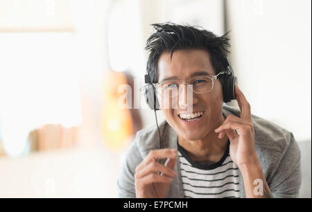 Cheerful man listening to music Stock Photo