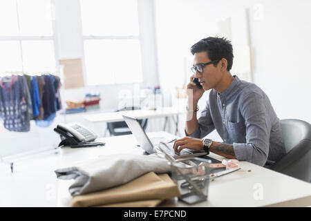 Side view of man working in studio Stock Photo