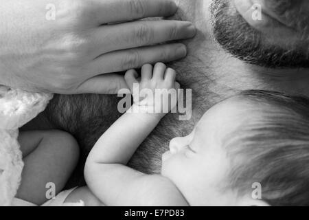 Father holding newborn daughter Stock Photo