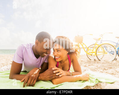Young couple relaxing on beach Stock Photo