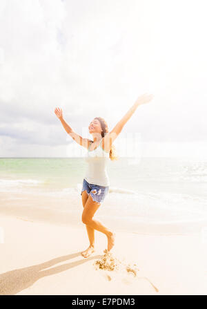 Happy woman on beach Stock Photo