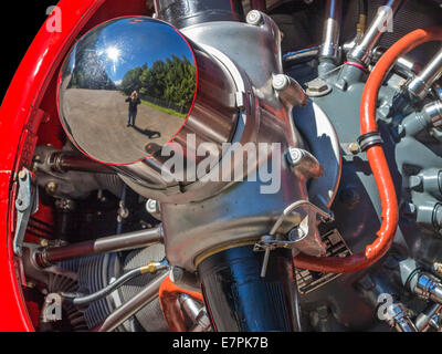 Selfie in an airplane engine. A Pratt & Whitney aircraft engine with a reflection of the photographer in the propeller boss. Stock Photo