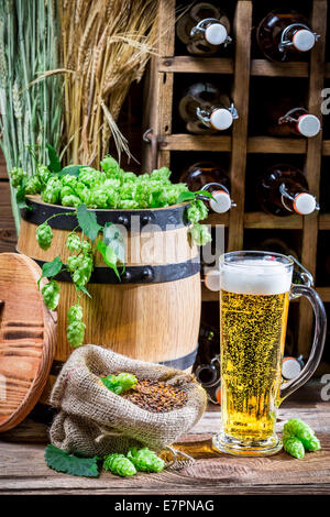 Barrel and two mug with barley hop Stock Photo - Alamy