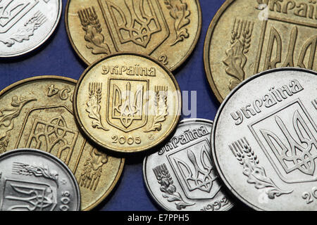 Coins of Ukraine. Ukrainian national coat of arms known as the Tryzub depicted in Ukrainian hryvnia coins. Stock Photo