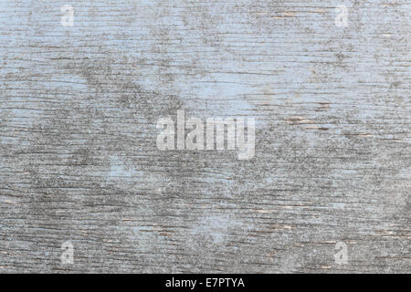 Aged wooden background of weathered distressed rustic wood with faded light blue paint showing woodgrain texture Stock Photo