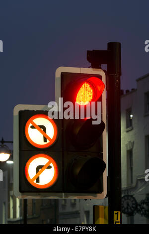 Traffic lights on red with no right or left turn signs Stock Photo