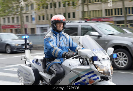 BRUSSELS, BELGIUM-SEPTEMBER 14, 2013: Belgian traffic policeman during his service on boulevard Du Regent Stock Photo