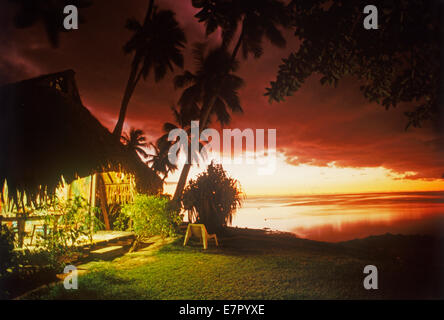 Hut illuminated at dusk on Moorea Island in French Polynesia Stock Photo