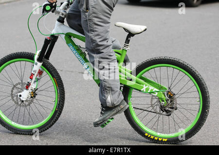 a BMX type cycle being ridden along a road in London Stock Photo