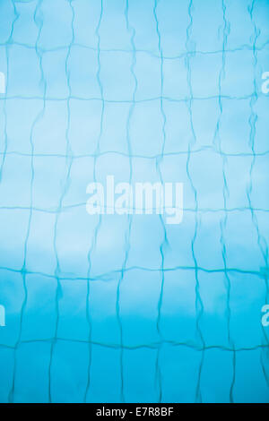Swimming pool background with distorted tiles below water surface Stock ...