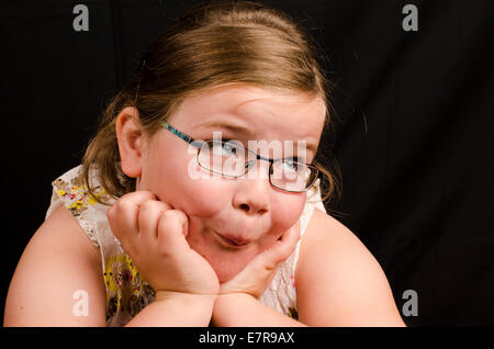 Wistful 8 year old girl Stock Photo - Alamy