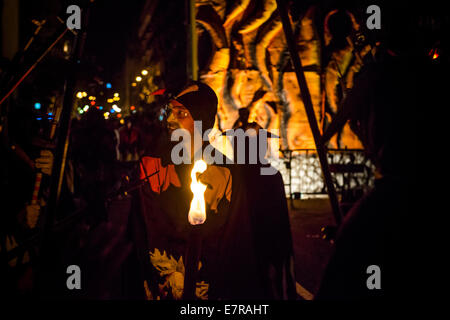 Barcelona, Spain. 21st Sep, 2014. A devil's face is illuminated by a torch during the Merce 2014 Credit:  matthi/Alamy Live News Stock Photo