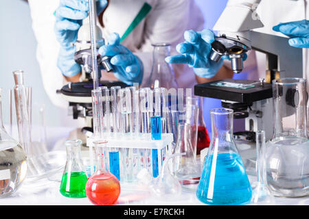 Two scientists in the chemical laboratory are doing experiments Stock Photo