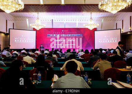 Beijing, China. 23rd Sep, 2014. Photo taken on Sept. 23, 2014 shows honored guests attending Chinese Enterprises' Overseas Performance Forum 2014 in Beijing, capital of China. Credit:  Zhang Yuwei/Xinhua/Alamy Live News Stock Photo