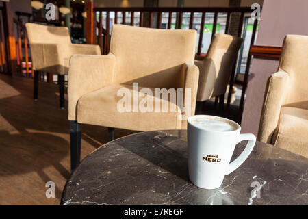 Large or Grande coffee on a table in Caffe Nero, UK Stock Photo