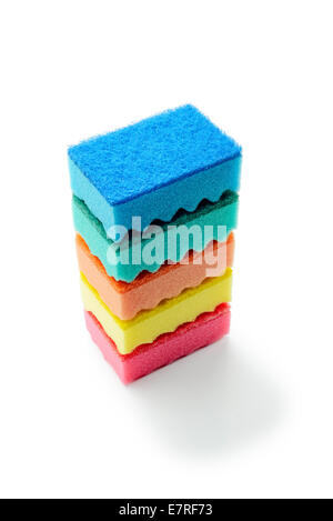 A stack of multicolored kitchen sponges isolated on white background Stock Photo