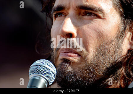 Russell Brand, comedian, speaking at The People's Assembly demonstration against Austerity, Parliament Square, London, 2014 Stock Photo