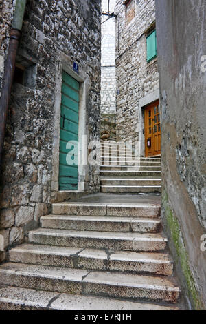Narrow alley in Sibenik. Sibenik is historic old town on the Adriatic coast of Croatia Stock Photo