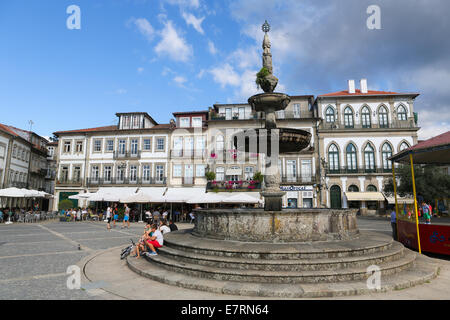 PONTE DE LIMA, PORTUGAL - AUGUST 3, 2014:  The main square Largo de Camoes with the 18th Century fountain in Ponte de Lima, a to Stock Photo