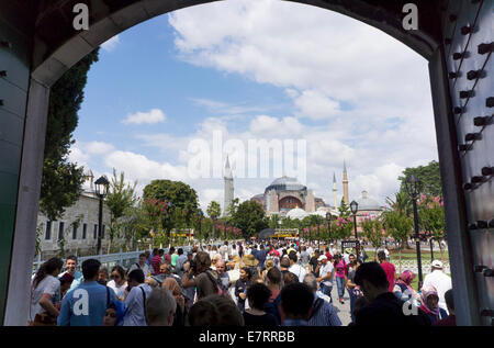 Istanbul, Turkey - August 3, 2014: Visitors near the Blue Mosque in Istanbul. The city receives over 10 million tourists annuall Stock Photo
