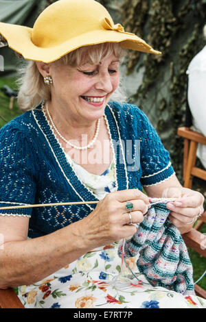 Knitting: senior elderly woman. Stock Photo