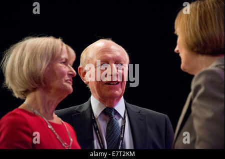 MANCHESTER, UK. 23rd September, 2014. Former Labour Leader Neil Kinnock and wife Glenys Kinnock chat with Harriet Harman, Shadow Deputy Prime Minister, on day three of the Labour Party's Annual Conference taking place at Manchester Central Convention Complex Credit:  Russell Hart/Alamy Live News. Stock Photo