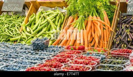 Market stall in Belgium selling colourful fruit & vegetables Stock Photo