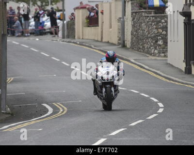Guy Martin riding his Tyco Suzuki in the Seniors race, during the 2014 Isle of Man TT. Stock Photo