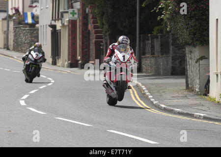 John McGuinness ahead of James Hillier during the Seniors race, finale of the 2014 Isle of Man TT. Stock Photo