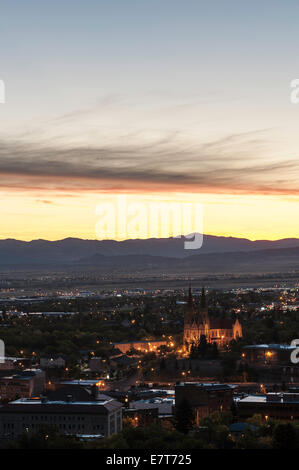 The skyline of Helena, dominated by the Cathedral of St. Helena, greets the dawn of a new day in front of the Big Belt Mountains Stock Photo