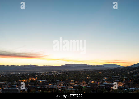 The skyline of Helena, dominated by the Cathedral of St. Helena, greets the dawn of a new day in front of the Big Belt Mountains Stock Photo