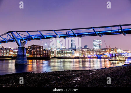 Millennium Bridge and the City of London at Night UK Stock Photo