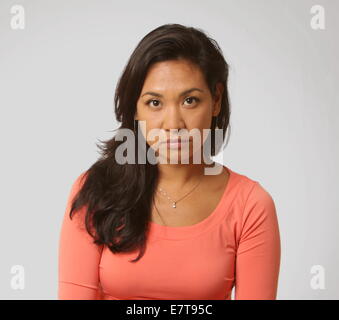 Beautiful woman with long luxurious dark hair posing for studio shots, New York, USA, September 16, 2014, © Katharine Andriotis Stock Photo