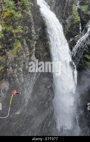 bungee jumping into a waterfall from the Gorsa Bridge in northern Norway Stock Photo