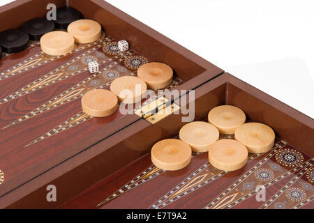 Backgammon table, chips and dices, isolated on white. Stock Photo