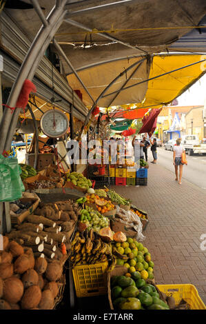 The floating market in Willemstad, Curacao is a popular gathering place and features freshly-caught fish and produce. Stock Photo