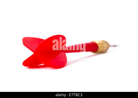 Single, red, plastic dart arrow, isolated on white background. Stock Photo