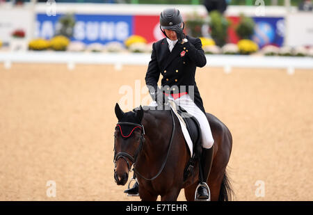 Incheon, South Korea. 24th Sep, 2014. Hua Tian of China competes during the eventing individual dressage match of equestrian at the 17th Asian Games in Incheon, South Korea, Sept. 24, 2014. Credit:  Bai Xuefei/Xinhua/Alamy Live News Stock Photo