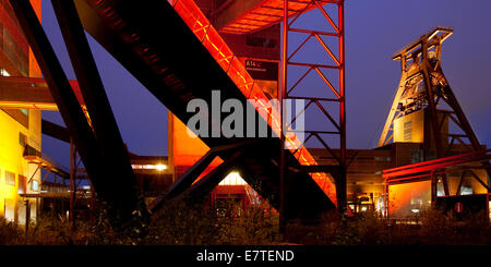 Illuminated gangway to the Ruhr Museum at the Zeche Zollverein Coal Mine Shaft XII with the headframe, Essen, Ruhr area Stock Photo