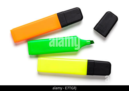 Highlighters on white background. Yellow, orange and green. Top view Stock Photo