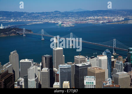 Downtown San Francisco, and San Francisco–Oakland Bay Bridge, crossing San Francisco Bay to Oakland, California, USA - aerial Stock Photo