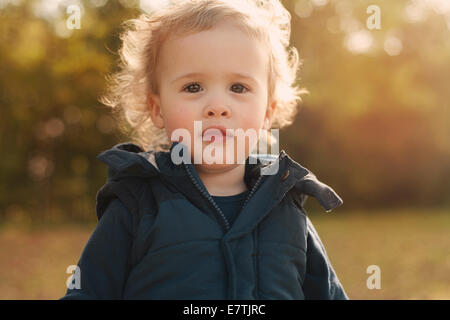 cute toddler in autumn park Stock Photo