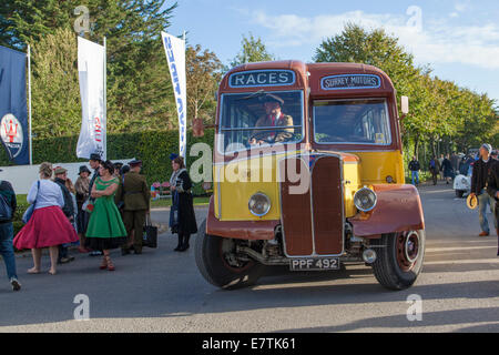 Old bus with ladies going to the races Stock Photo