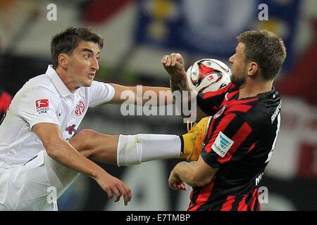 Frankfurt Main, Germany. 23rd Sep, 2014. Frankfurt's Marco Russ (R) and Mainz's Filip Duricic in action during the Bundesliga soccer match between Eintracht Frankfurt and 1. FSV Mainz 05 at Commerzbank Arena in Frankfurt Main, Germany, 23 September 2014. Photo: Fredrik von Erichsen/dpa/Alamy Live News Stock Photo