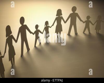 paper chain family holding hands Stock Photo - Alamy