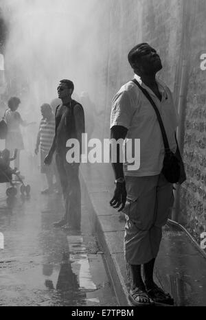 Two men standing in a street in the fog Stock Photo